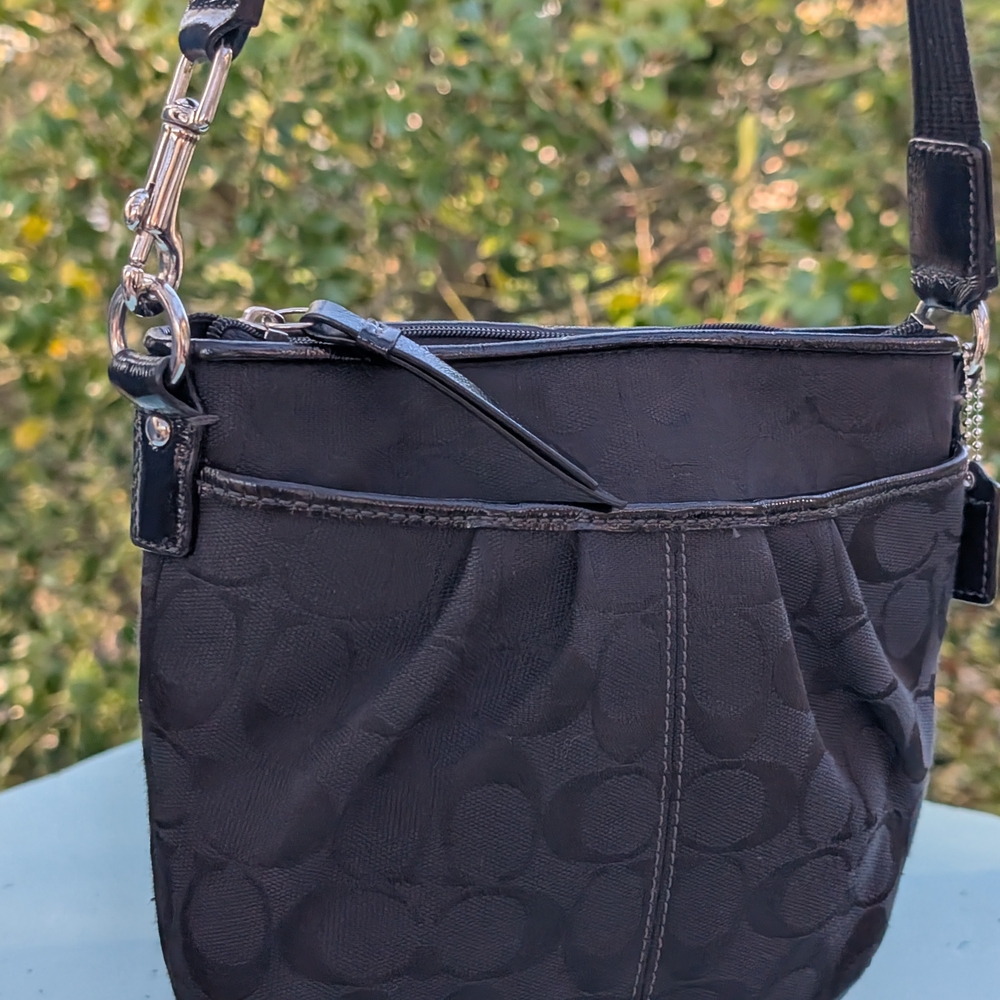 Coach Black Crossbody Bag with Adjustable Strap and Zipper Closure